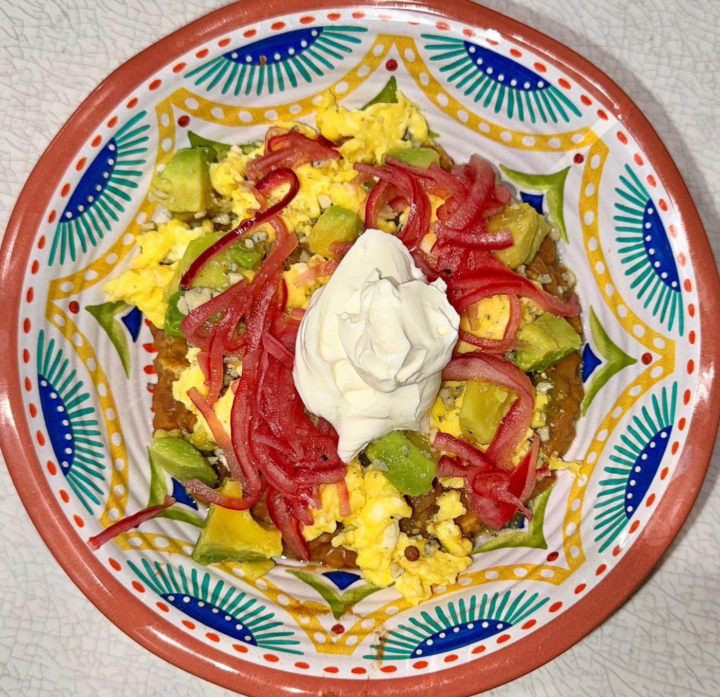 Chilaquiles grain bowl with farro, beans and salsa verde